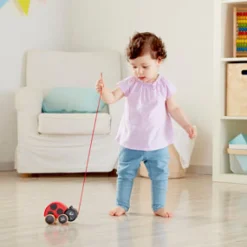 Hape Wooden Lady Bug Pull Along Hot